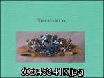   Co. Aquamarine, diamond 3 stone ring,18 Kt Yellow Gold $4000.  