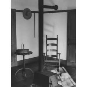  Iron Woodstove with a Ladder Backed Wooden Armchair in a 