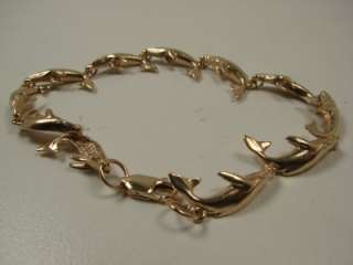 14KT YELLOW WYLAND HUMPBACK WHALES BRACELET. IN EXCELLENT WORKING 