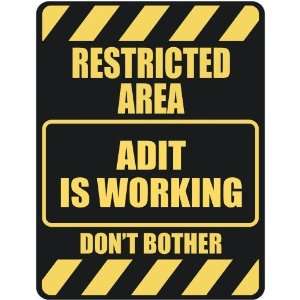   RESTRICTED AREA ADLI IS WORKING  PARKING SIGN