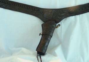 Hand tooled, leather Western gun belt and holster  