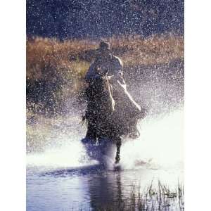 Cowboy on Horseback Galloping through River, Ponderosa Ranch, Seneca 