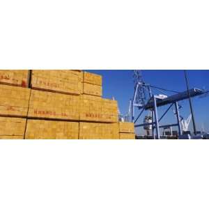  Stacks of Lumber at a Dock with a Crane by Panoramic 