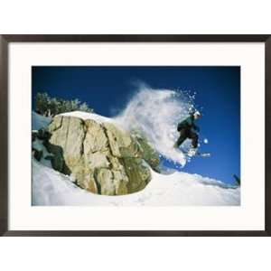  Snowboarder jumping off a big rock Sports Framed Art 
