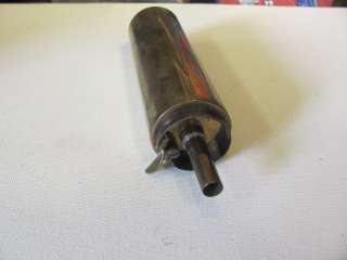 This is a vintage brass black powder measure.