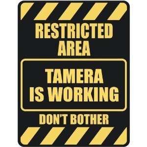   RESTRICTED AREA TAMERA IS WORKING  PARKING SIGN