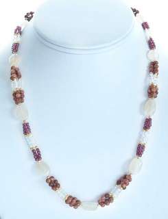 necklace of sunstone, crystal, garnet, and moonstone beads.