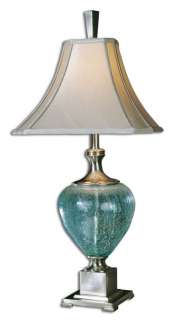 This fascinating table lamp brings together blue/green crackle glass 