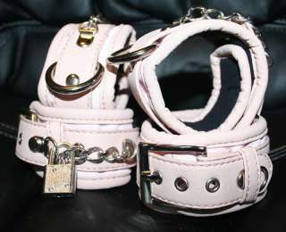 Wrist and ankle cuffs   shows padding, leather piping, locking chain 