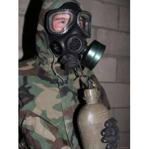 Marine Drinks Water from His Canteen Through His Gas Mask Inside the 