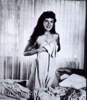 Bunny Yeager in Bed Hiding Behind Sheet  